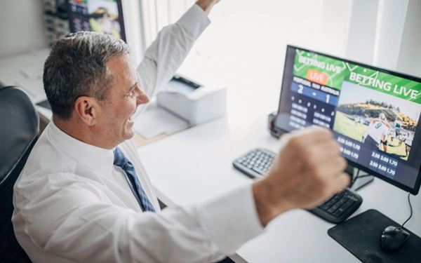 older gentleman winning at sports betting